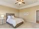 Comfortable bedroom with neutral tones and a large window at 10169 Briargrove Way, Highlands Ranch, CO 80126