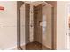 Bathroom featuring glass walk-in shower with tiled surround and rain shower head at 2700 E Cherry Creek S Dr # 302, Denver, CO 80209