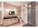Bathroom featuring modern vanity, sleek tiles, and walk-in glass shower at 2700 E Cherry Creek S Dr # 302, Denver, CO 80209