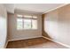 Bedroom featuring a large window and neutral decor at 2700 E Cherry Creek S Dr # 302, Denver, CO 80209