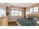 Cozy bedroom featuring a large window and neutral decor at 2700 E Cherry Creek S Dr # 302, Denver, CO 80209