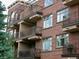 Brick building with multiple balconies featuring metal railings and contemporary architectural details at 2700 E Cherry Creek S Dr # 302, Denver, CO 80209