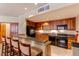 Well-equipped kitchen with modern appliances, granite countertop bar, and ample cabinet space at 2700 E Cherry Creek S Dr # 302, Denver, CO 80209