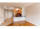 Open kitchen has stainless appliances and flows into dining area with hardwood flooring at 2700 E Cherry Creek S Dr # 302, Denver, CO 80209