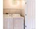 Laundry room featuring washer and dryer at 2700 E Cherry Creek S Dr # 302, Denver, CO 80209