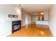 Open living room with hardwood floors and a modern fireplace at 2700 E Cherry Creek S Dr # 302, Denver, CO 80209