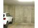 Parking garage space with car, painted parking space line on the garage floor at 2700 E Cherry Creek S Dr # 302, Denver, CO 80209