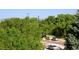 Scenic street view with lush green trees, passing cars, and mountains in the distance at 2700 E Cherry Creek S Dr # 302, Denver, CO 80209