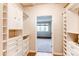 Spacious walk-in closet with custom storage and built-in drawers at 2700 E Cherry Creek S Dr # 302, Denver, CO 80209