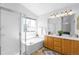 Bright bathroom featuring separate shower and tub, complete with a double vanity at 5174 W 123Rd Pl, Broomfield, CO 80020