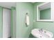 Charming bathroom with green walls, a vintage sink, and a convenient walk-in closet at 5174 W 123Rd Pl, Broomfield, CO 80020