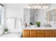 Bright bathroom with double vanity, tile accents, and modern fixtures at 5174 W 123Rd Pl, Broomfield, CO 80020