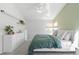 Bright bedroom featuring a vaulted ceiling, a large window, and modern furnishings at 5174 W 123Rd Pl, Broomfield, CO 80020