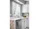 Close up of modern kitchen countertops and cabinets with a window view at 5174 W 123Rd Pl, Broomfield, CO 80020