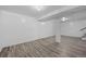 Finished basement with vinyl flooring, column support and ample room for multiple uses at 3715 N Jackson St, Denver, CO 80205