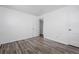 Clean bedroom with modern wood-look flooring and white walls at 3715 N Jackson St, Denver, CO 80205
