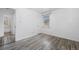 Bright bedroom features white walls and wood-look floors, connecting to bath at 3715 N Jackson St, Denver, CO 80205