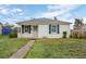 Charming home featuring white exterior and well-maintained lawn at 3715 N Jackson St, Denver, CO 80205