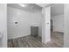 Hallway features wood-look floors, white walls, and grey base cabinets at 3715 N Jackson St, Denver, CO 80205