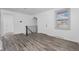 Bright living area boasting laminate floors and staircase access at 3715 N Jackson St, Denver, CO 80205