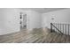 Open-concept living space with sleek laminate flooring at 3715 N Jackson St, Denver, CO 80205