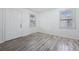 Cozy living room with stylish laminate floors and ample sunlight at 3715 N Jackson St, Denver, CO 80205