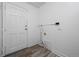 Mud room with white door and modern wood-look flooring at 3715 N Jackson St, Denver, CO 80205