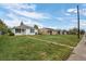 Residential street view featuring multiple houses and lawns at 3715 N Jackson St, Denver, CO 80205