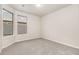 Bright bedroom with large windows and neutral carpet at 308 Josef Cir, Fort Lupton, CO 80621