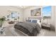 Beautifully staged bedroom with stylish rug, bedding, and artwork at 308 Josef Cir, Fort Lupton, CO 80621