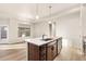 A modern kitchen island with a stainless steel sink and dishwasher, perfect for meal prep at 308 Josef Cir, Fort Lupton, CO 80621