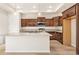 Modern kitchen with sleek countertops, stainless steel appliances, and dark wood cabinetry at 308 Josef Cir, Fort Lupton, CO 80621