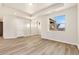 Inviting living space with hardwood floors, ample lighting, and large windows offering scenic views at 308 Josef Cir, Fort Lupton, CO 80621