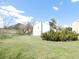 Spacious grassy backyard, with potential for gardening or recreation; Mountain view at 9180 Spruce Mountain Rd, Larkspur, CO 80118