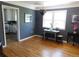 Cozy dining room features hardwood floors, bright windows, and stylish decor, perfect for intimate meals at 9180 Spruce Mountain Rd, Larkspur, CO 80118