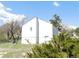 Back exterior showcasing the home's minimalist design with a single window against a bright blue sky backdrop at 9180 Spruce Mountain Rd, Larkspur, CO 80118