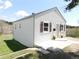 Cozy home featuring fresh exterior paint, decorative shutters, and a well-maintained lawn at 9180 Spruce Mountain Rd, Larkspur, CO 80118