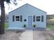 Inviting home showcasing curb appeal, fresh exterior paint, decorative shutters, and a well-manicured lawn at 9180 Spruce Mountain Rd, Larkspur, CO 80118
