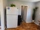 Functional kitchen area features a refrigerator and convenient access to adjacent rooms at 9180 Spruce Mountain Rd, Larkspur, CO 80118