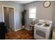 Well-lit kitchen showcases classic appliances and rustic wood floors, creating a cozy cooking environment at 9180 Spruce Mountain Rd, Larkspur, CO 80118