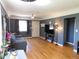 Inviting living room boasting hardwood floors, neutral walls, and a ceiling fan at 9180 Spruce Mountain Rd, Larkspur, CO 80118