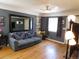 Inviting living room boasting hardwood floors, neutral walls, and a ceiling fan at 9180 Spruce Mountain Rd, Larkspur, CO 80118