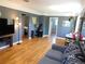Inviting living room boasting hardwood floors, neutral walls, and a ceiling fan at 9180 Spruce Mountain Rd, Larkspur, CO 80118