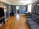 Inviting living room boasting hardwood floors, neutral walls, a ceiling fan, and an adjacent table for dining at 9180 Spruce Mountain Rd, Larkspur, CO 80118