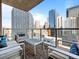 Private balcony with outdoor seating and stunning views of the downtown skyline at 891 14Th St # 1109, Denver, CO 80202