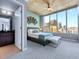 Bedroom with a large window, city view, ceiling fan, and en suite bathroom at 891 14Th St # 1109, Denver, CO 80202