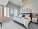 Comfortable bedroom with cityscape views, a ceiling fan, and modern decor at 891 14Th St # 1109, Denver, CO 80202