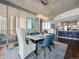 Elegant dining area with a modern chandelier and views of the city skyline at 891 14Th St # 1109, Denver, CO 80202