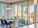 Bright dining room with floor-to-ceiling windows showcasing city views and modern chandelier at 891 14Th St # 1109, Denver, CO 80202