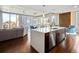 Modern kitchen with white island and stainless steel appliances, with views of the city at 891 14Th St # 1109, Denver, CO 80202